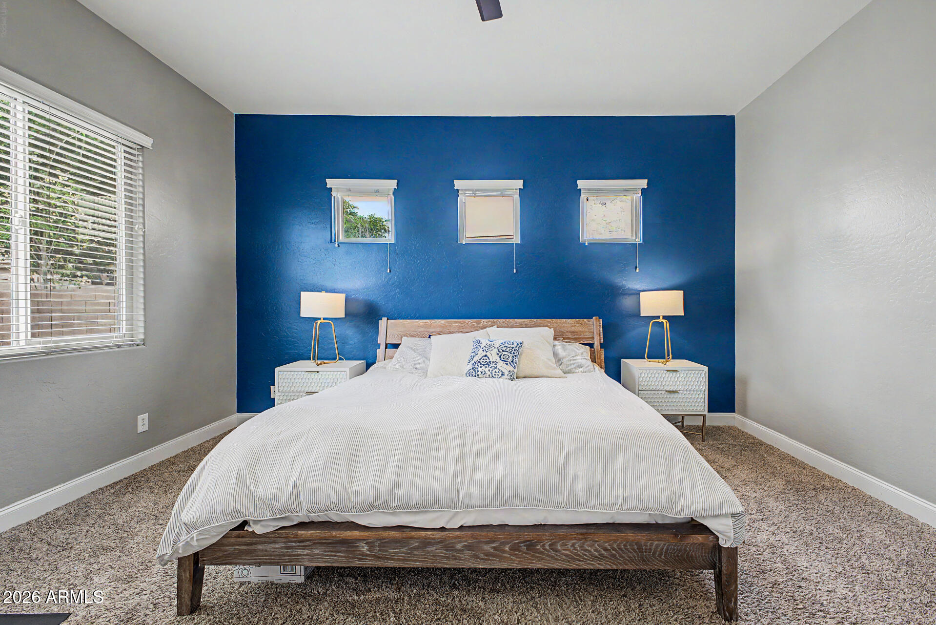 4272 East Buckboard Road Gilbert, AZ 85297 - Photo 20 of 37 a bedroom with a bed and windows