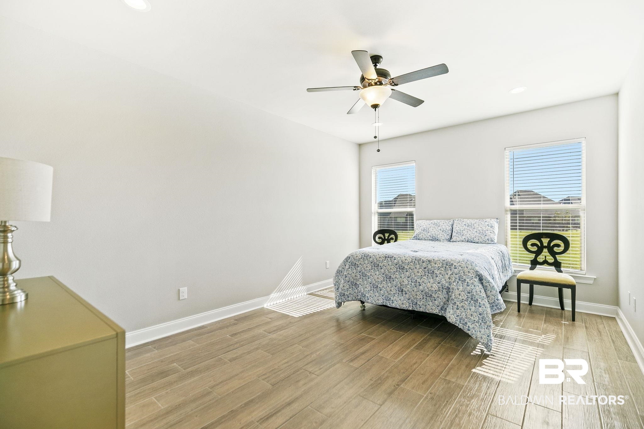 10140 Chipper Lane Foley, AL 36535 - Photo 26 of 72 Bedroom featuring ceiling fan and light hardwood / wood-style flooring