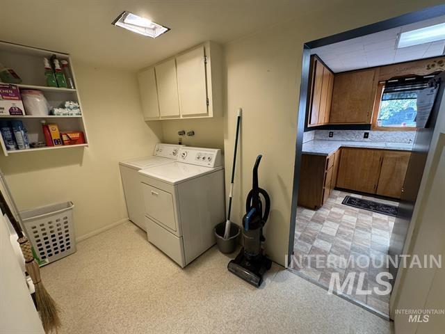 217 Main Street Kooskia, ID 83539 - Photo 13 of 34 Laundry area with separate washer and dryer, cabinet space