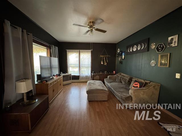 217 Main Street Kooskia, ID 83539 - Photo 6 of 34 Living room with laminate finished floors and a ceiling fan