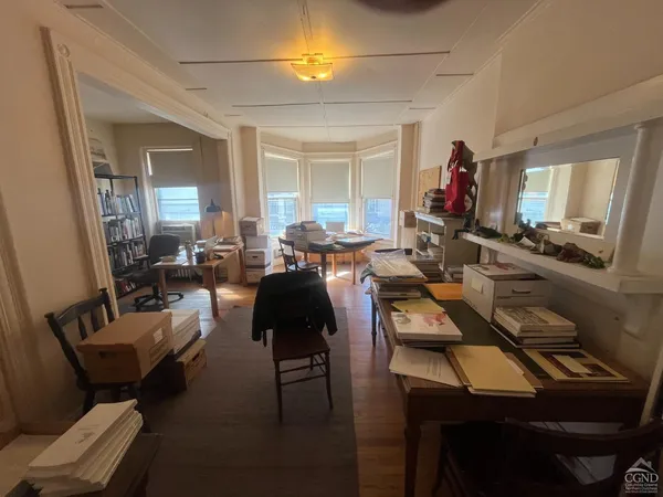 a view of a livingroom with furniture and a window