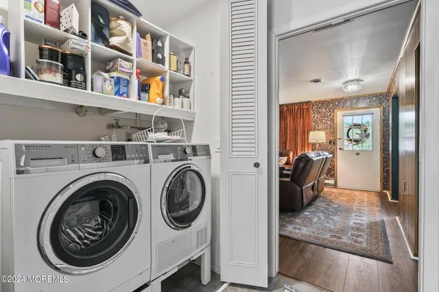 a view of livingroom with washer and dryer
