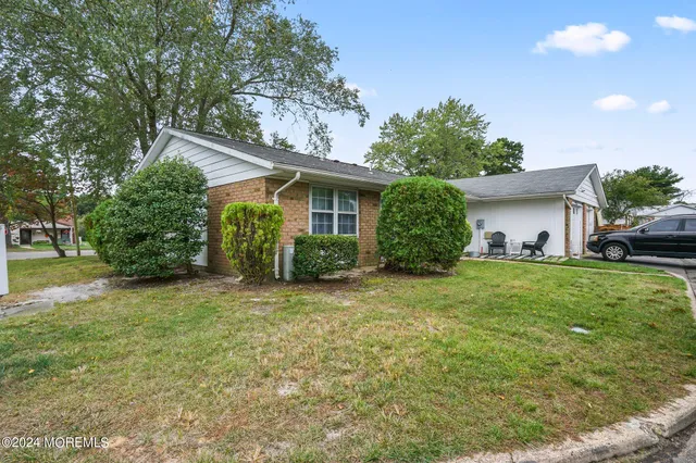 a house view with a garden space