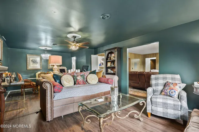 a view of a livingroom with furniture and wooden floor