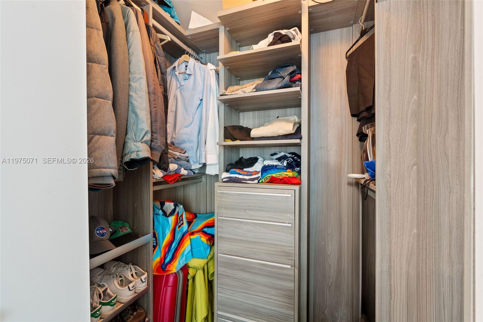 1300 South Miami Avenue, Unit 2807 Miami, FL 33130 - Photo 15 of 22 a view of walk in closet with clothes and shoes