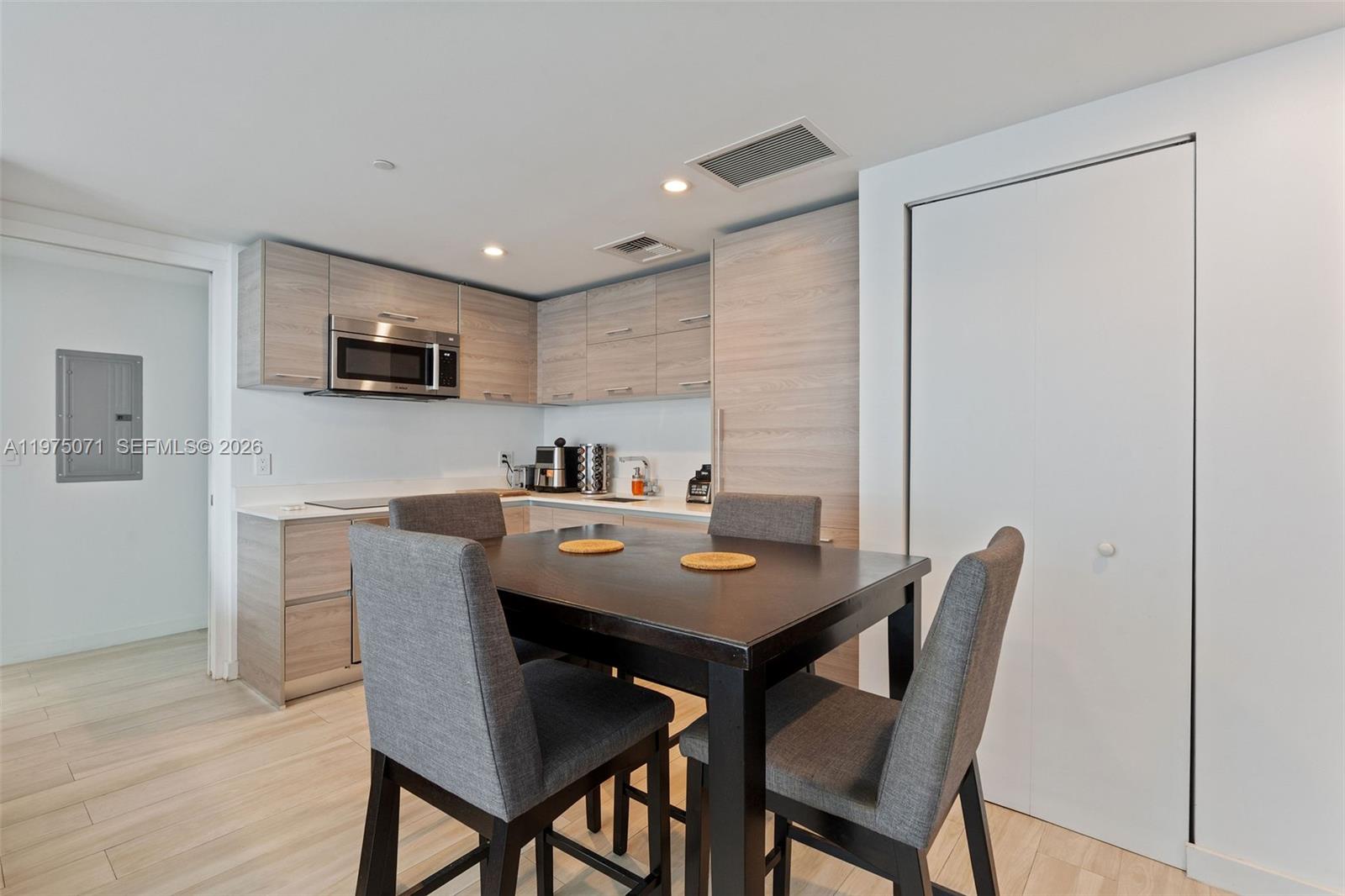 1300 South Miami Avenue, Unit 2807 Miami, FL 33130 - Photo 6 of 22 a view of a dining room with furniture