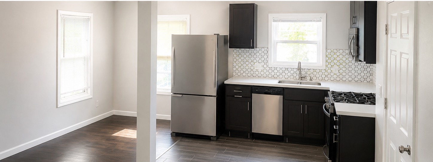 1825 1/2 Santa Rosa Street Houston, TX 77023 - Photo 2 of 7 a kitchen with stainless steel appliances a refrigerator sink and window