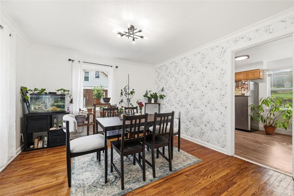 315 Woodside Road Pittsburgh, PA 15221 - Photo 10 of 46 a view of a dining room with furniture and wooden floor