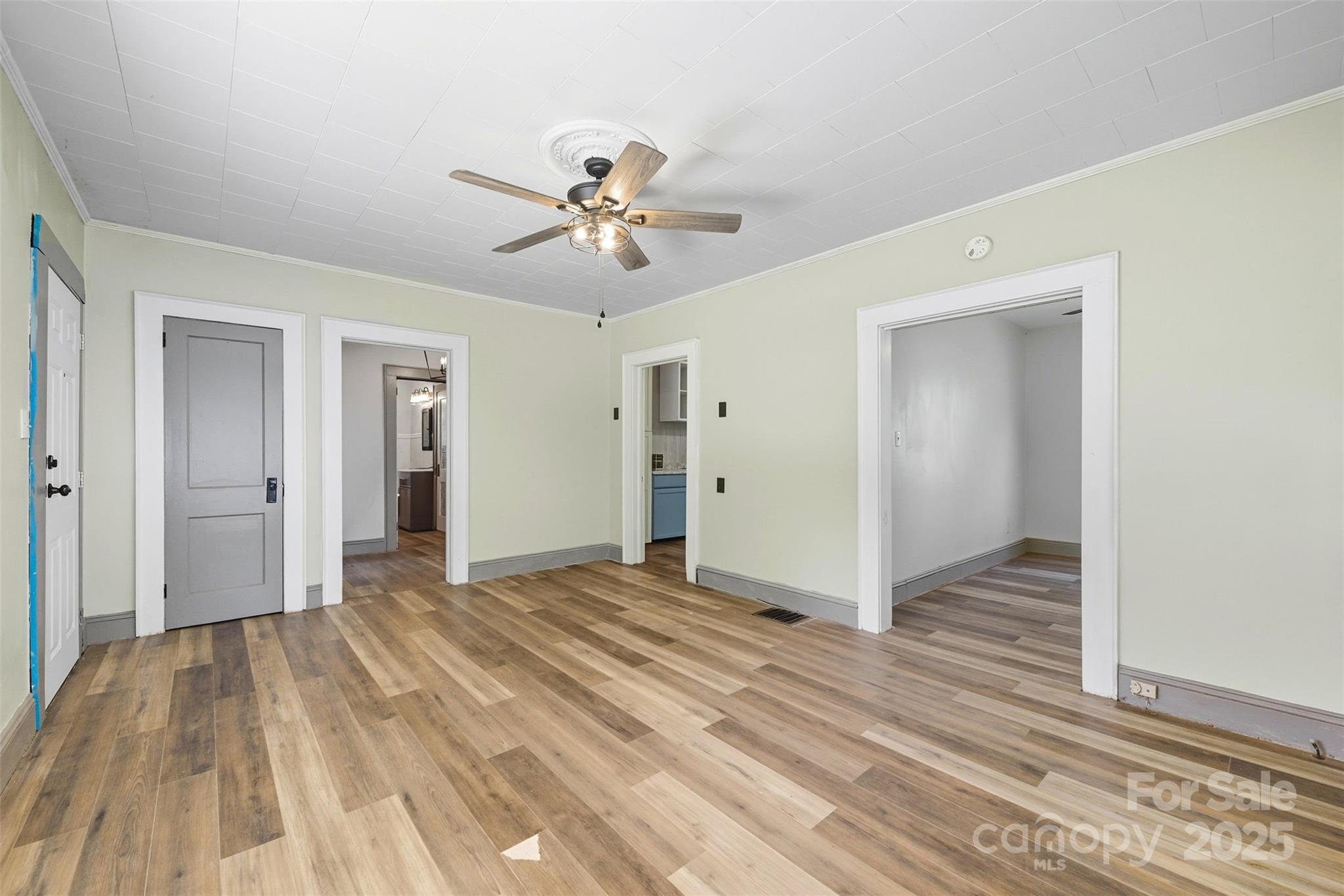 515 Suttle Street Shelby, NC 28150 - Photo 14 of 25 a view of empty room with wooden floor and fan