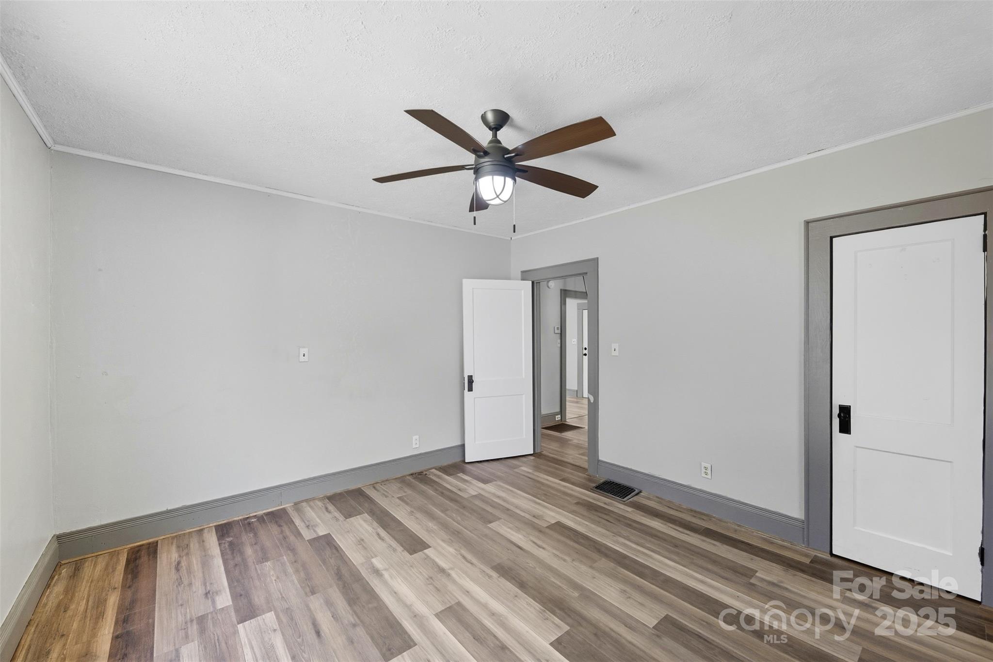 515 Suttle Street Shelby, NC 28150 - Photo 19 of 25 a view of a livingroom with a ceiling fan and window