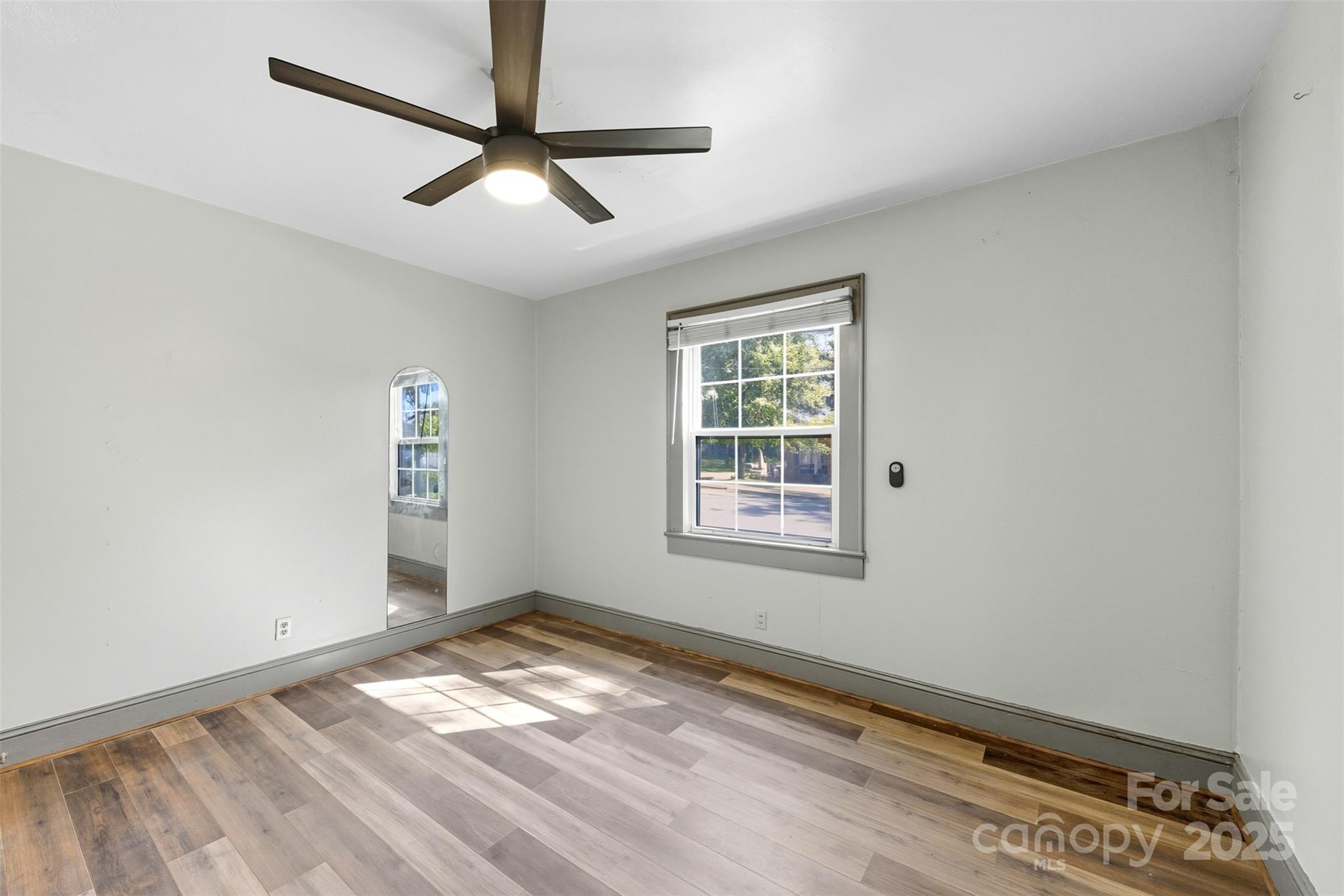 515 Suttle Street Shelby, NC 28150 - Photo 21 of 25 a view of a room with wooden floor and a window
