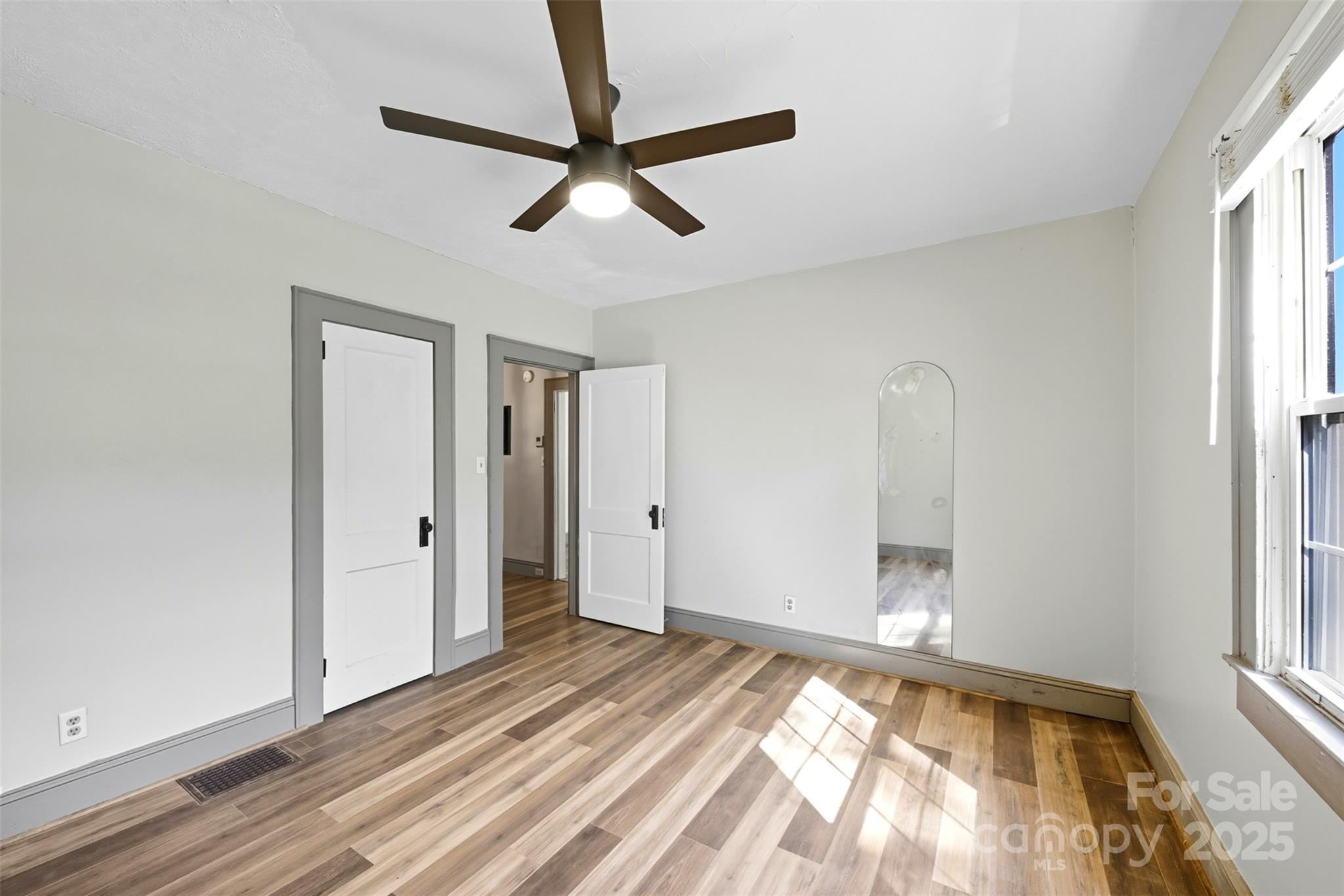 515 Suttle Street Shelby, NC 28150 - Photo 22 of 25 a view of a livingroom with wooden floor and a window