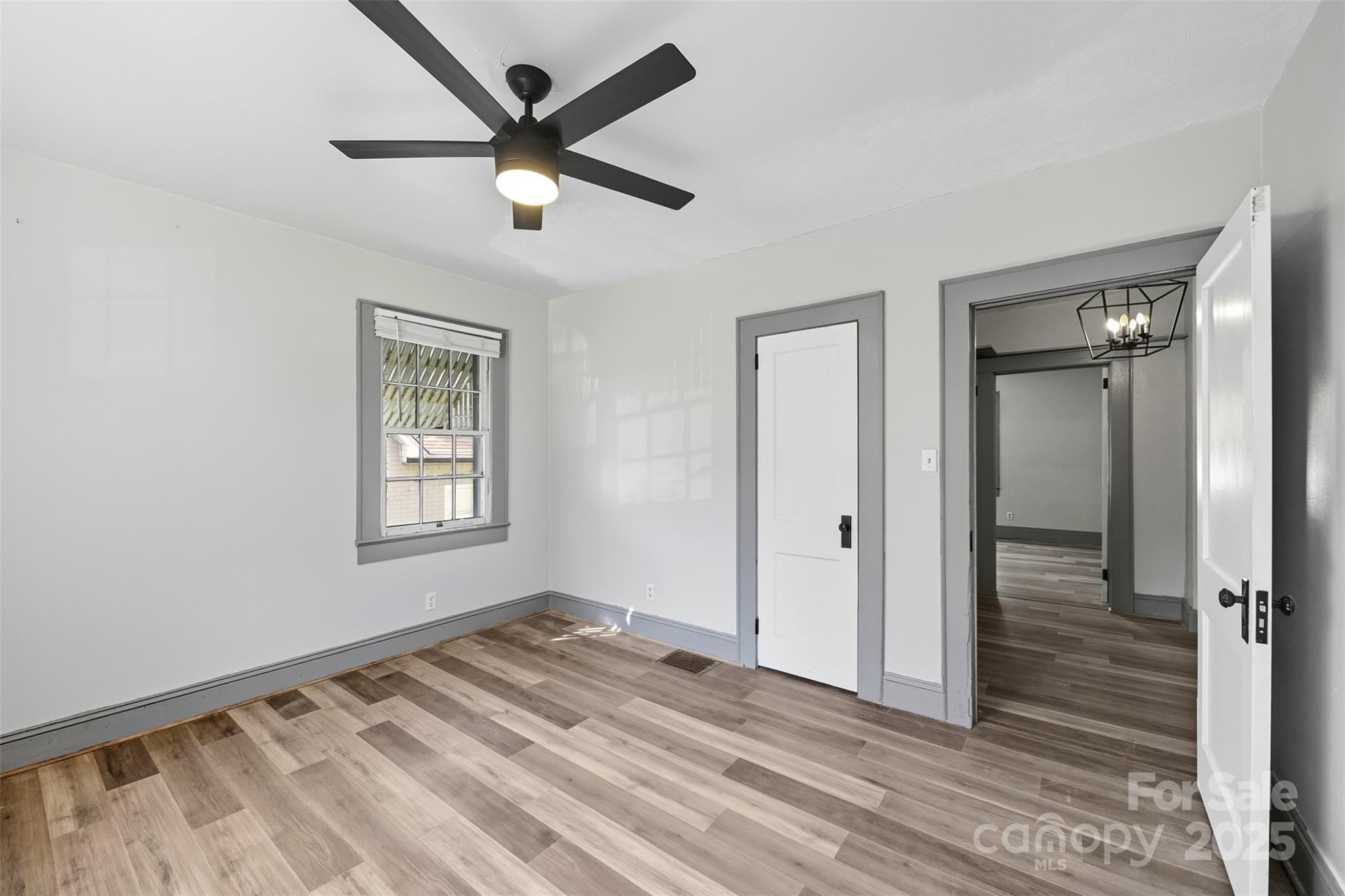 515 Suttle Street Shelby, NC 28150 - Photo 23 of 25 wooden floor in an empty room with a window