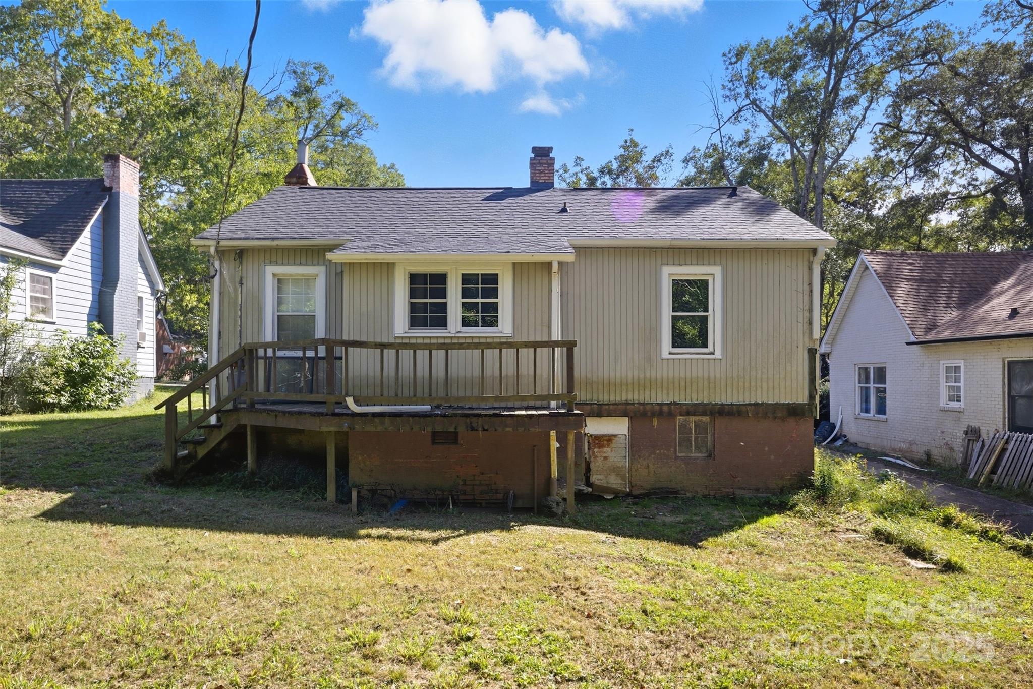 515 Suttle Street Shelby, NC 28150 - Photo 24 of 25 a backyard of a house with yard fire pit and outdoor seating