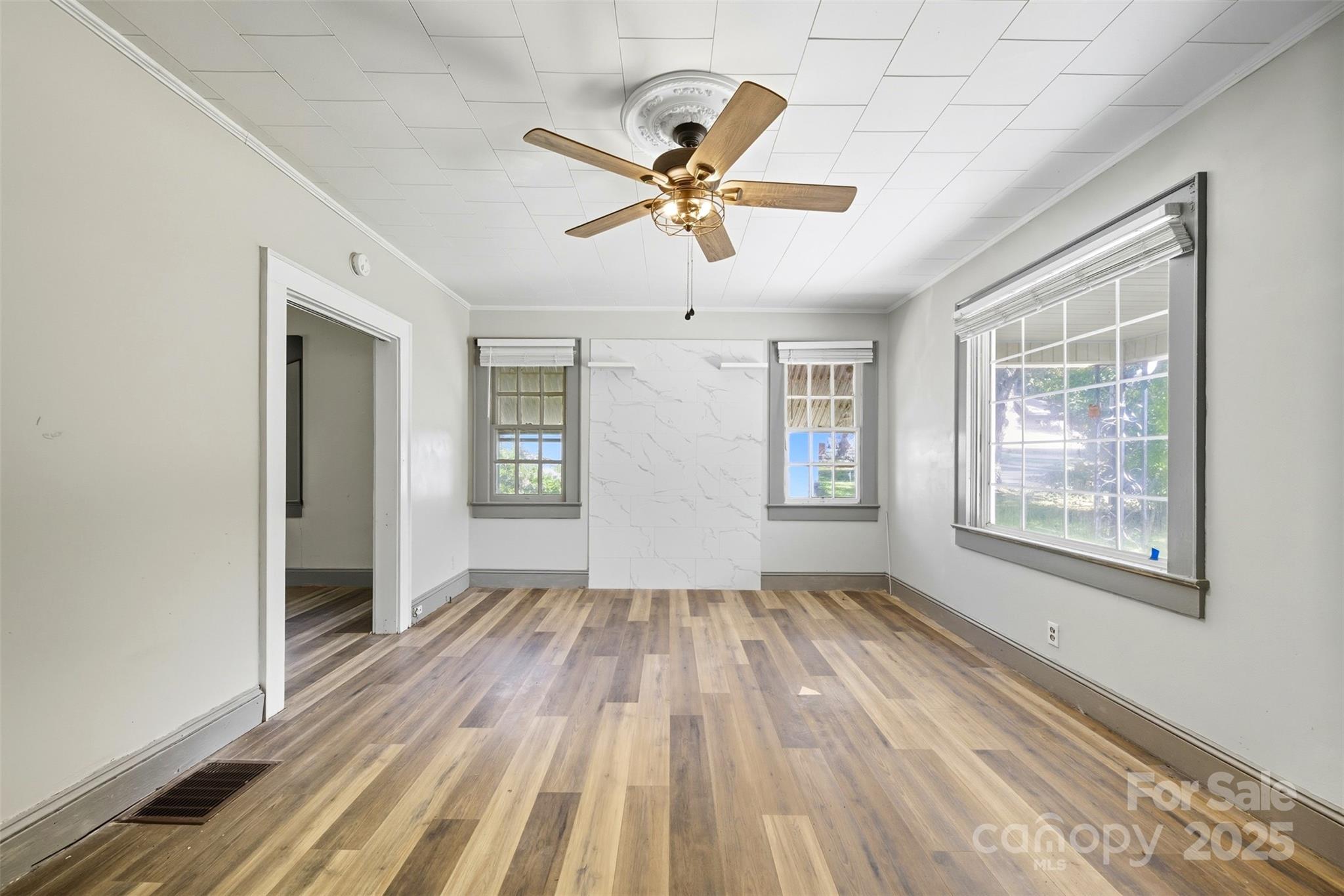 515 Suttle Street Shelby, NC 28150 - Photo 4 of 25 a view of a livingroom with a window and wooden floor