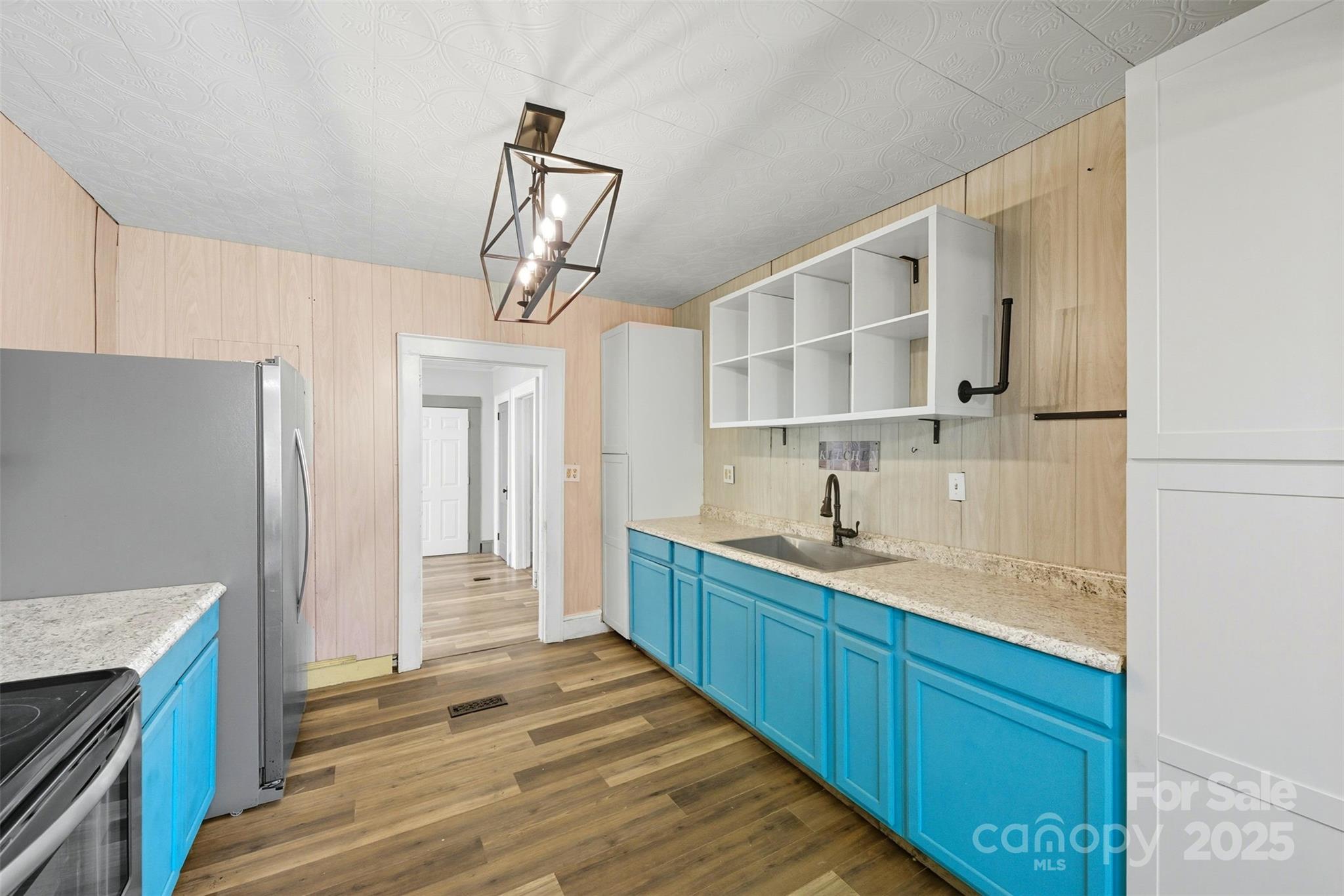 515 Suttle Street Shelby, NC 28150 - Photo 8 of 25 a kitchen with a sink and a refrigerator