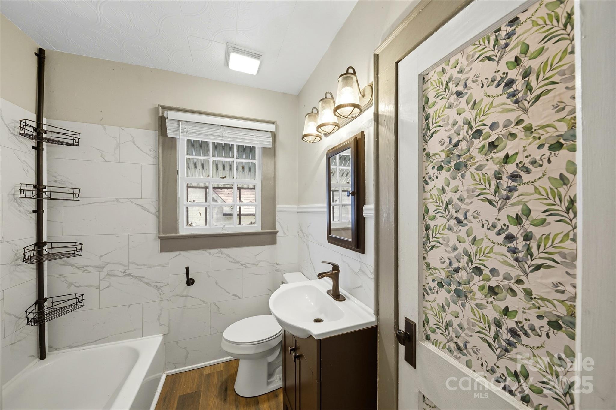515 Suttle Street Shelby, NC 28150 - Photo 10 of 25 a bathroom with a sink toilet and shower