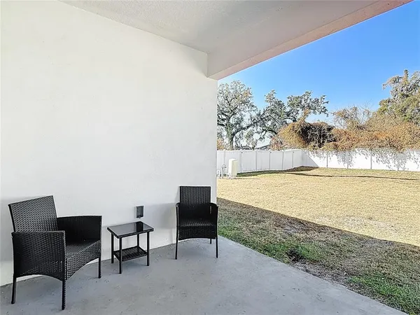 a aerial view of a house with large trees