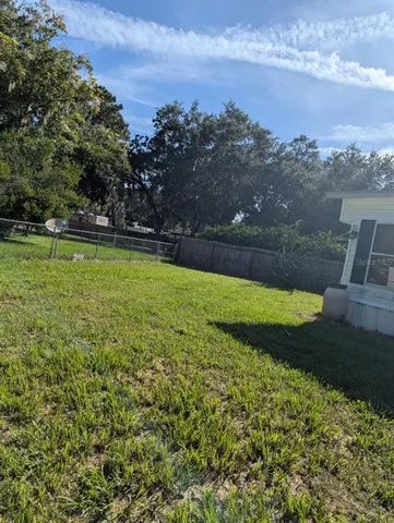 a view of a golf course with a lake