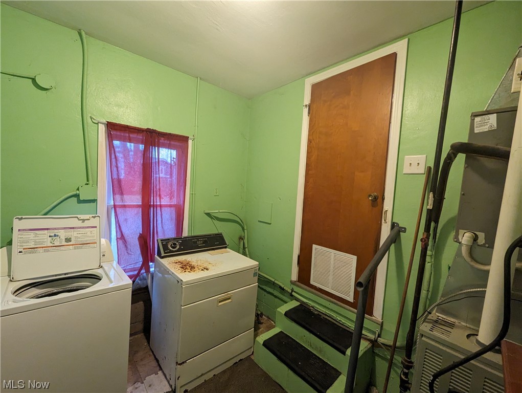 653 Rokeby Road Eastlake, OH 44095 - Photo 13 of 15 Laundry area with washer and clothes dryer and tile flooring