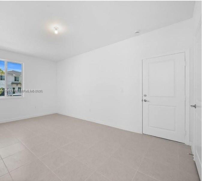 701 Southeast 14th Court Homestead, FL 33034 - Photo 13 of 18 a view of an empty room