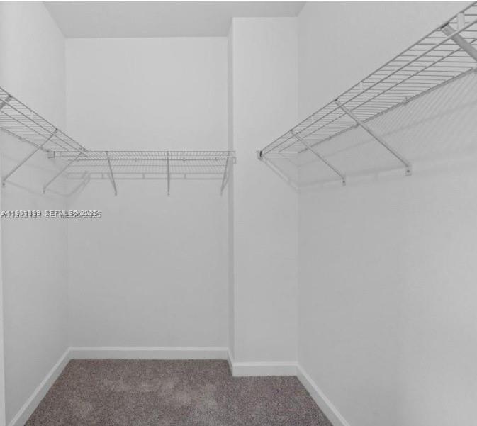 701 Southeast 14th Court Homestead, FL 33034 - Photo 15 of 18 a view of a room with racks on the wall