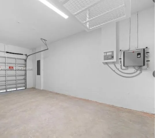 a view of a storage & utility room with racks on the wall