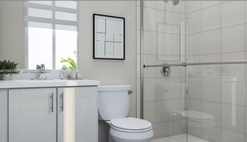 701 Southeast 14th Court Homestead, FL 33034 - Photo 3 of 18 a bathroom with a sink toilet and shower