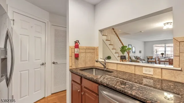 a view of a kitchen from a hallway