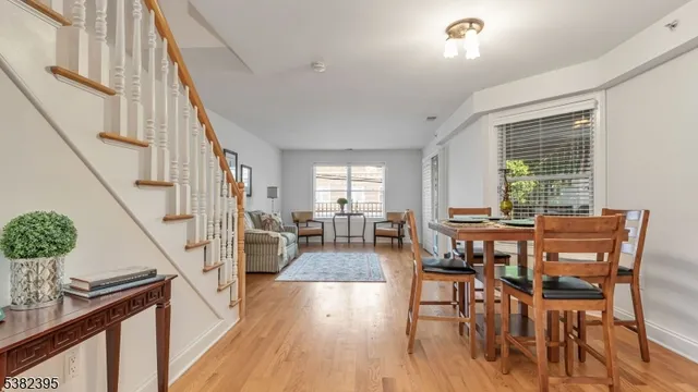a view of a livingroom with furniture window and wooden floor