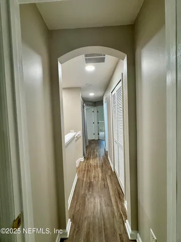 a view of an empty room and a window