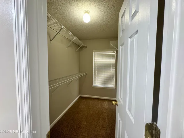 a spacious bathroom with a double vanity sink and a mirror