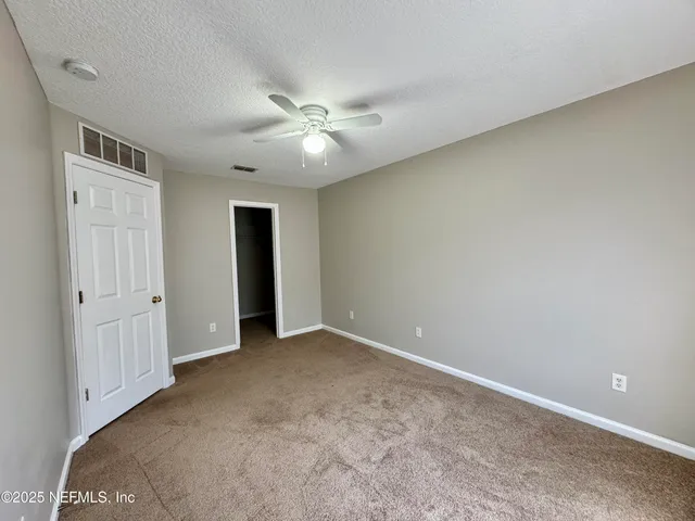 a view of a table and chairs in the garden