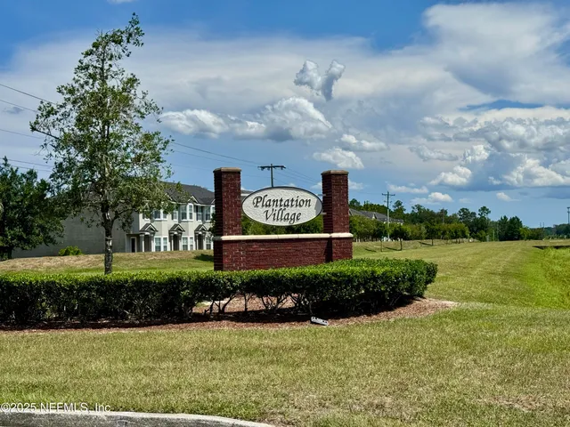 a view of a lake with a big yard