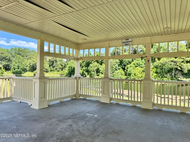 a view of a park with large trees