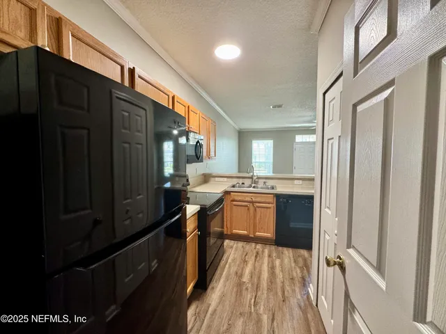 a white toilet sitting next to a shower