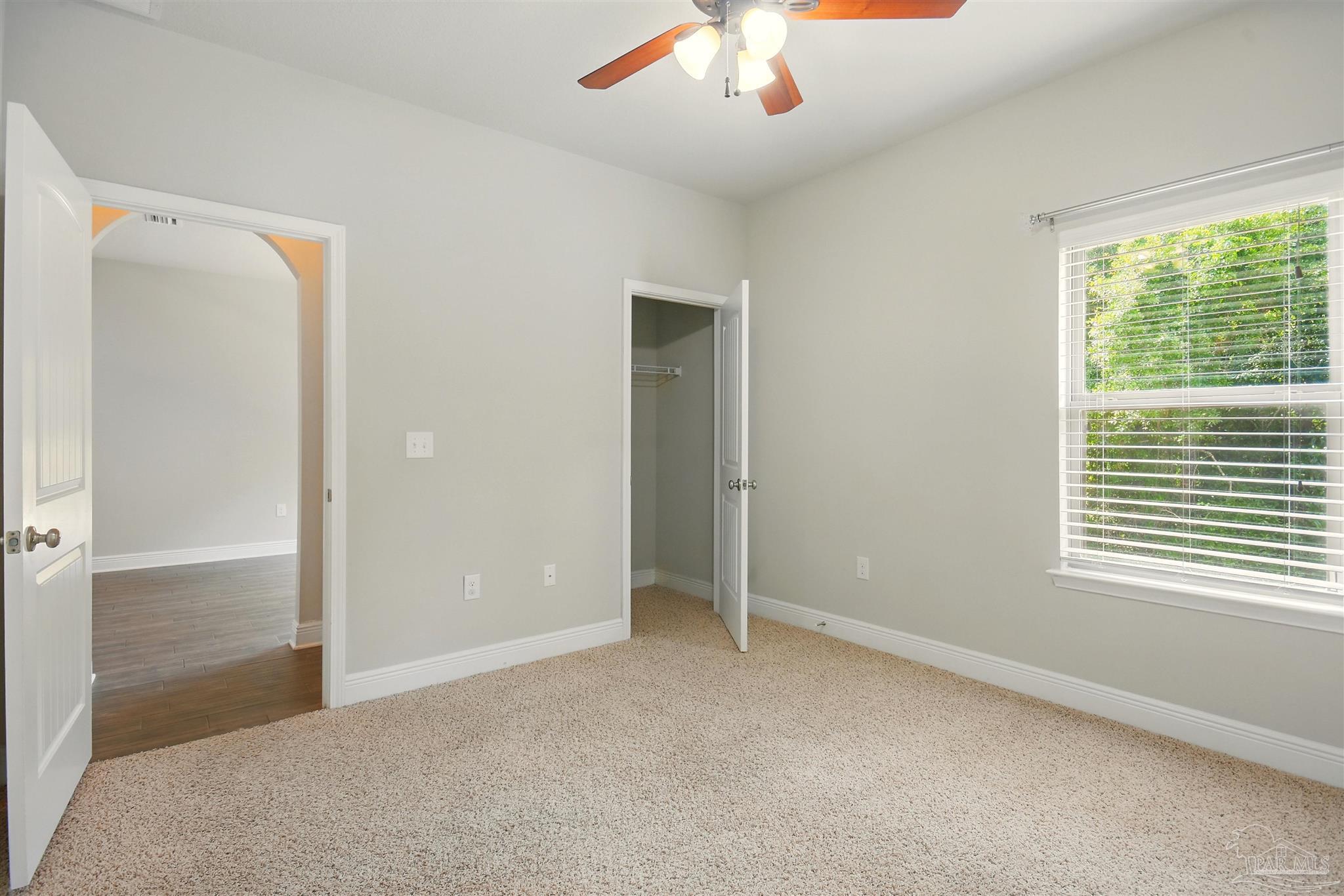 2701 Tulip Hill Road Pace, FL 32571 - Photo 19 of 42 a view of an empty room with a window