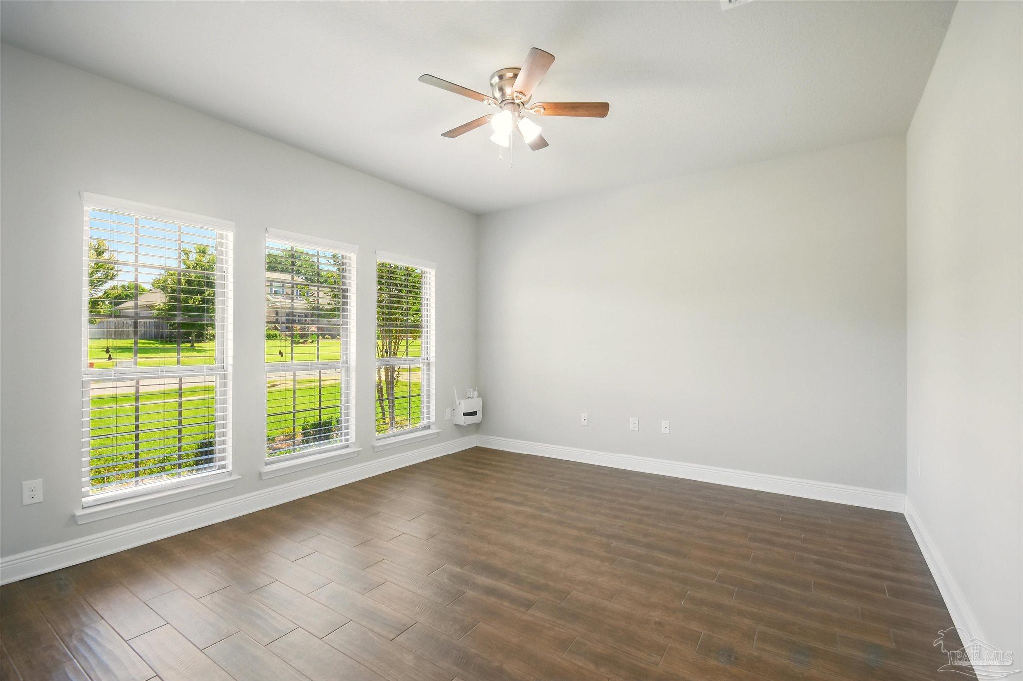2701 Tulip Hill Road Pace, FL 32571 - Photo 2 of 42 a view of room with window and ceiling fan