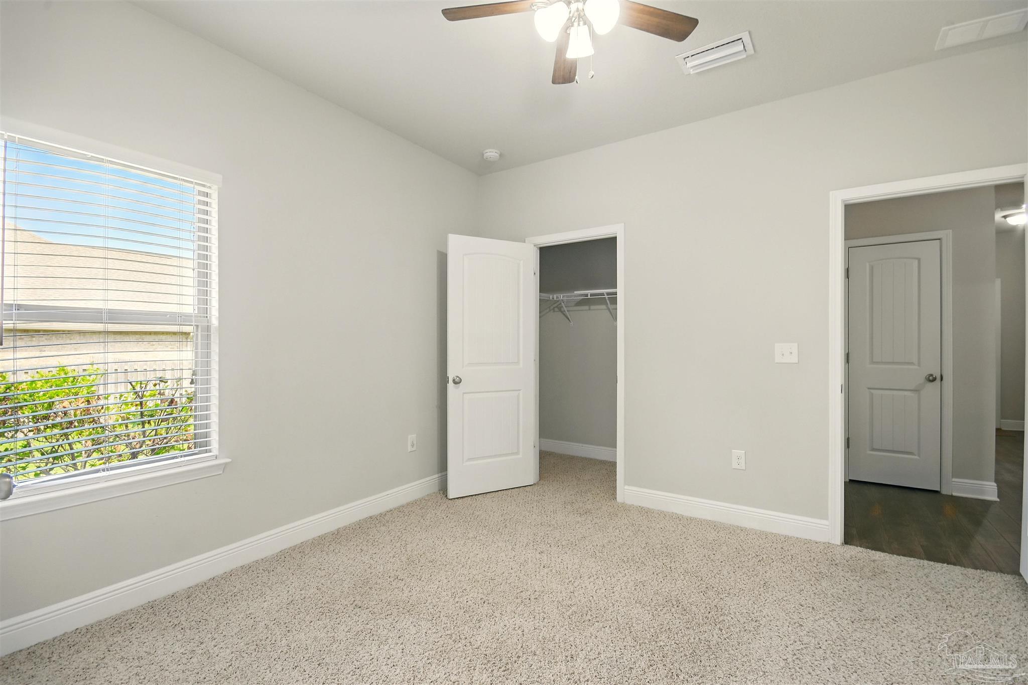 2701 Tulip Hill Road Pace, FL 32571 - Photo 22 of 42 a view of an empty room with a window