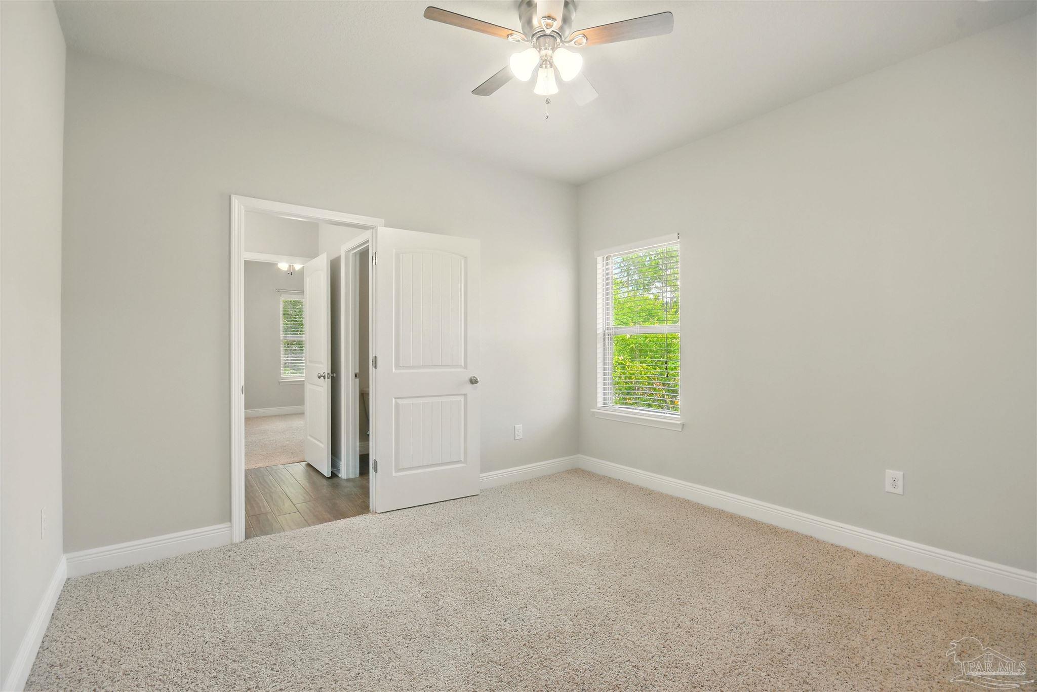 2701 Tulip Hill Road Pace, FL 32571 - Photo 23 of 42 a view of an empty room with a window