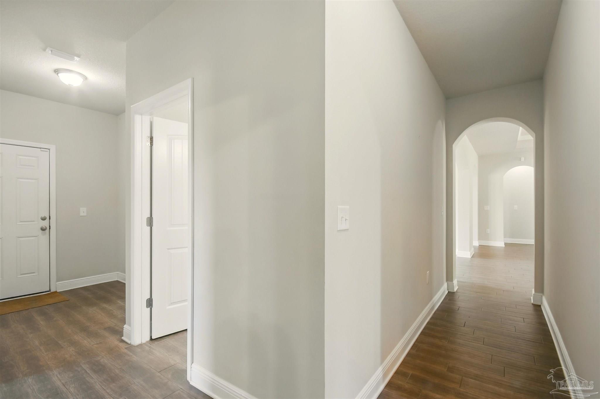 2701 Tulip Hill Road Pace, FL 32571 - Photo 24 of 42 a view of a room with wooden floor