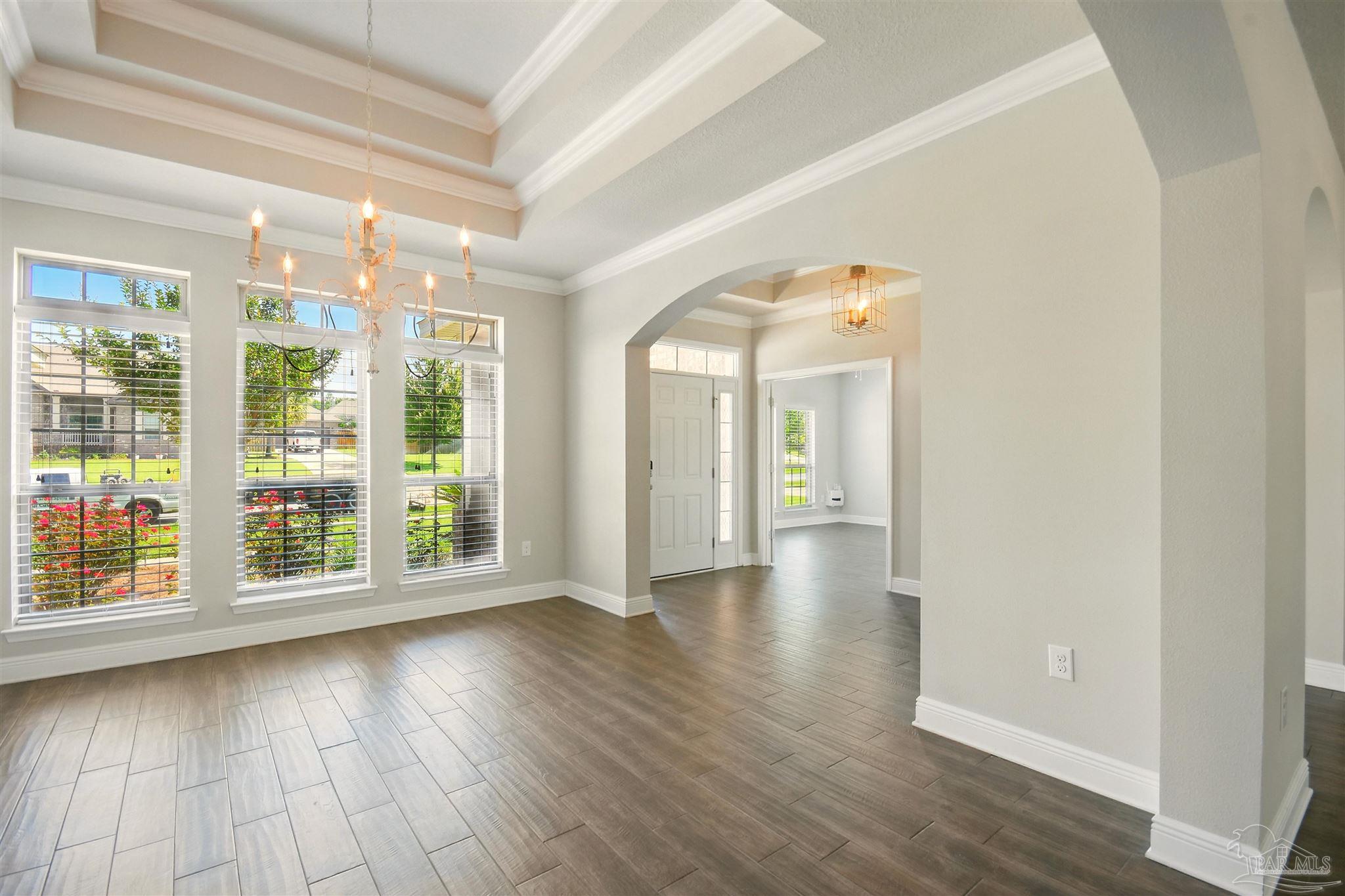 2701 Tulip Hill Road Pace, FL 32571 - Photo 3 of 42 wooden floor in an empty room with a window