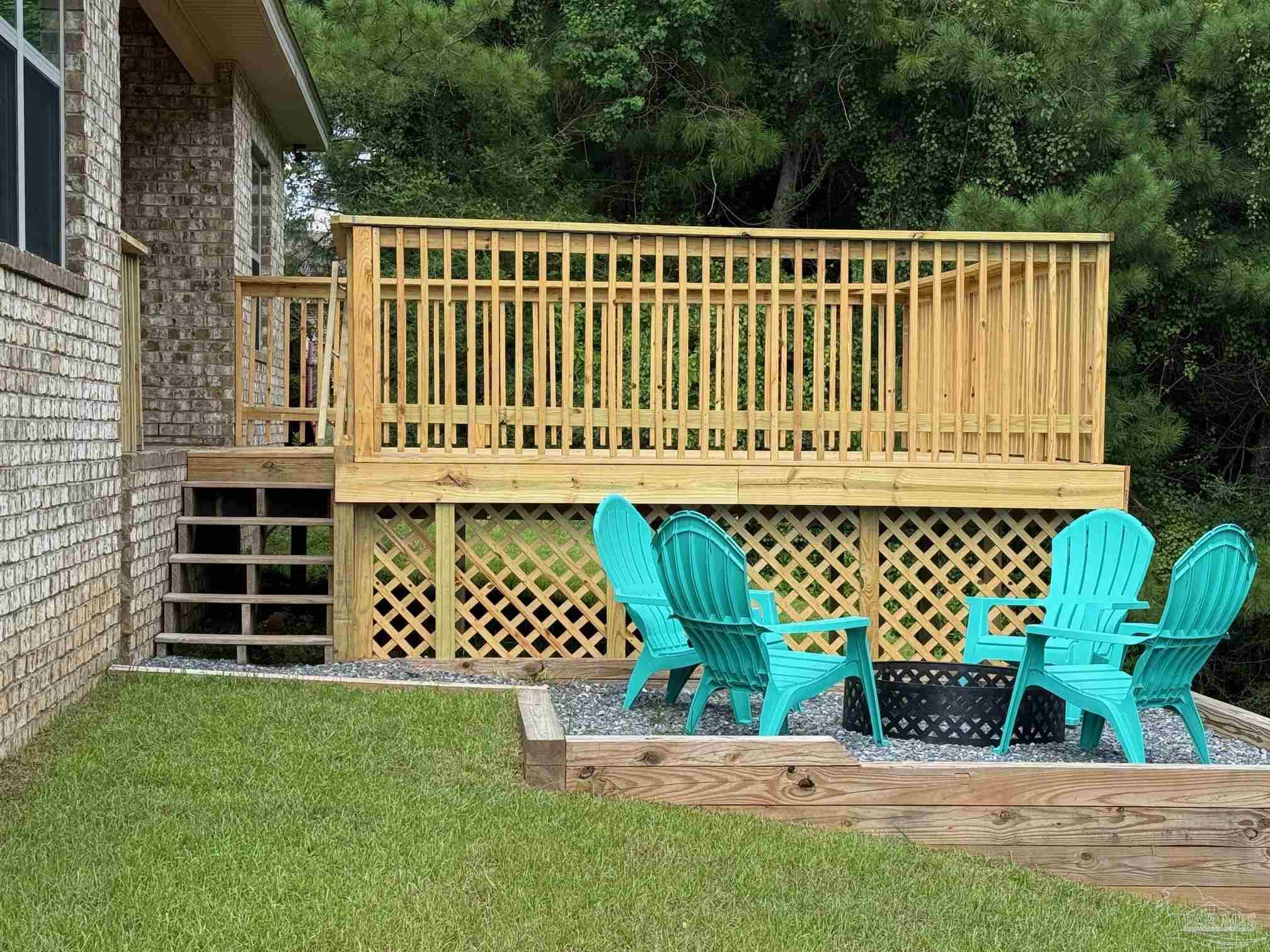 2701 Tulip Hill Road Pace, FL 32571 - Photo 35 of 42 a house view with a garden space