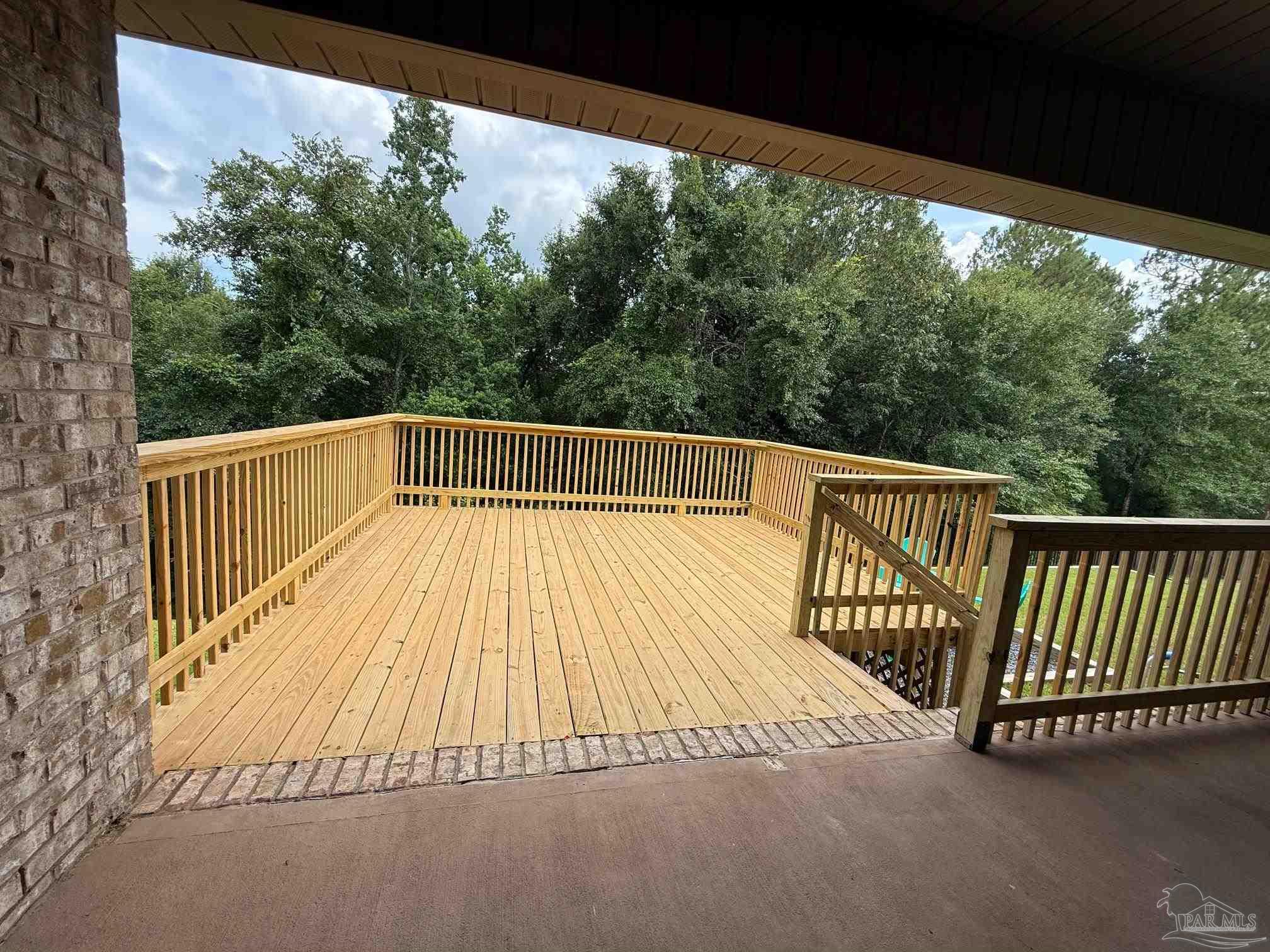 2701 Tulip Hill Road Pace, FL 32571 - Photo 38 of 42 a view of balcony with wooden floor and fence