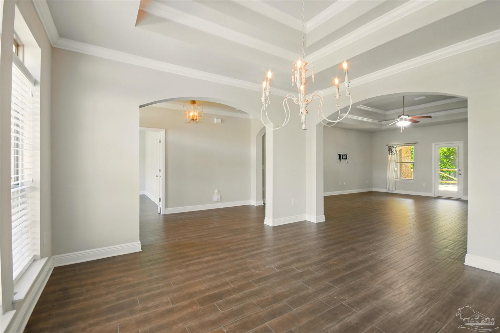 2701 Tulip Hill Road Pace, FL 32571 - Photo 5 of 42 a view of a room with wooden floor and window