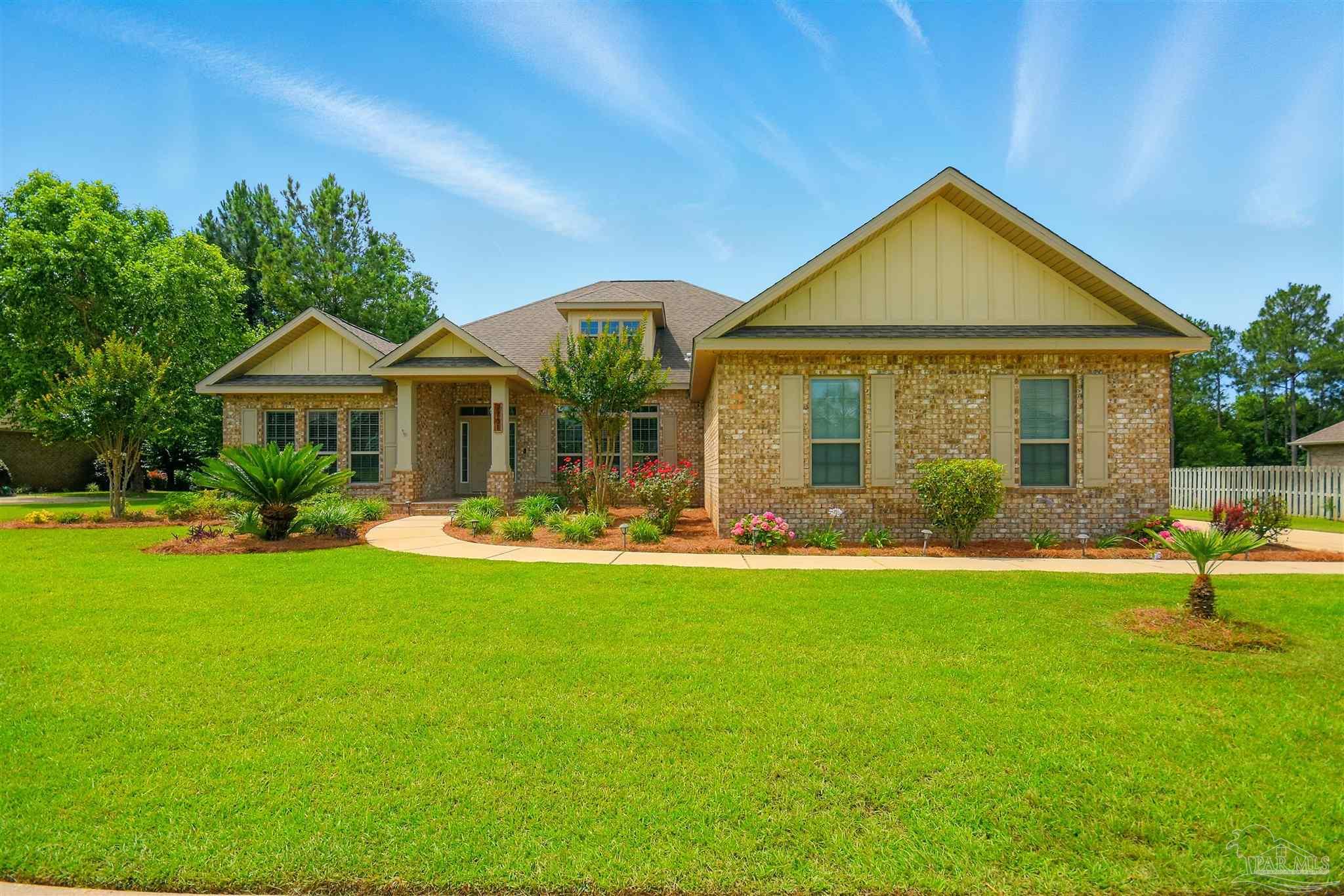 2701 Tulip Hill Road Pace, FL 32571 - Photo 6 of 42 a front view of a house with a yard