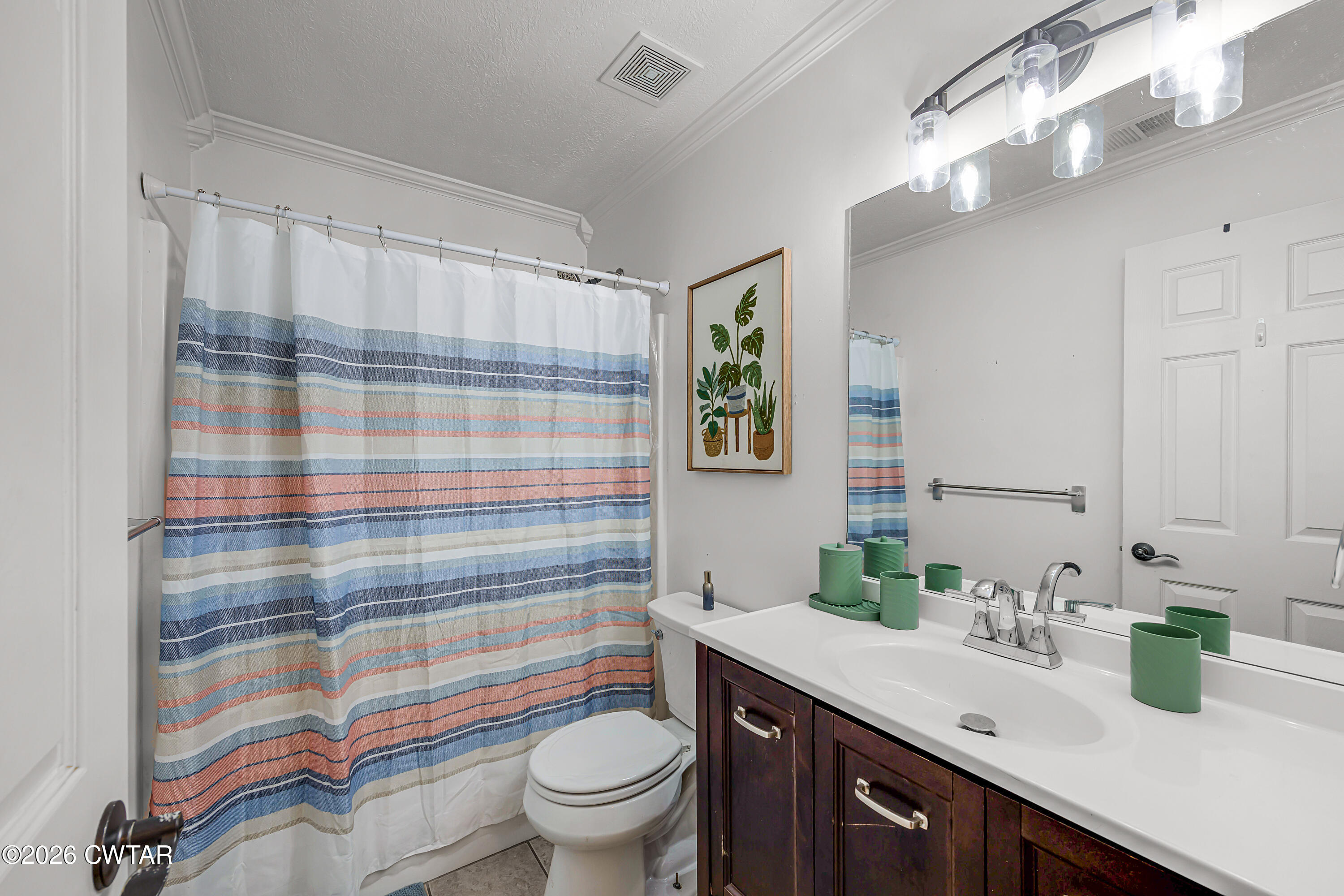 23 Matrix Cove Jackson, TN 38305 - Photo 15 of 19 a bathroom with a sink a toilet a shower and a mirror