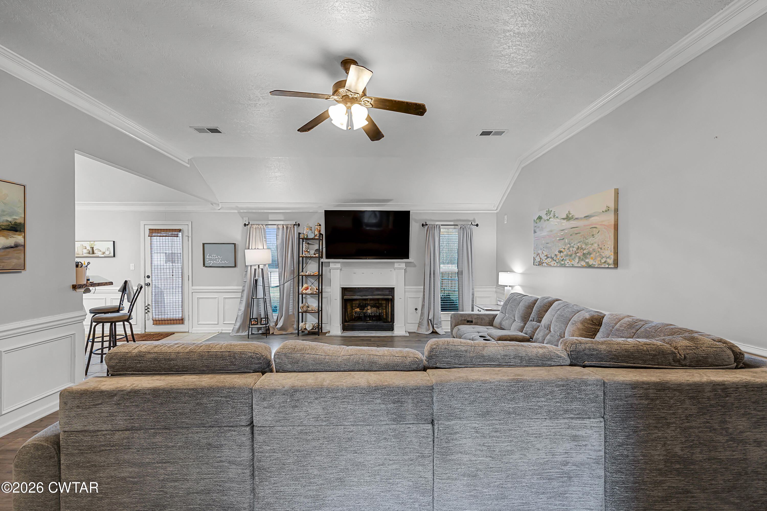 23 Matrix Cove Jackson, TN 38305 - Photo 5 of 19 a living room with furniture a fireplace and a flat screen tv