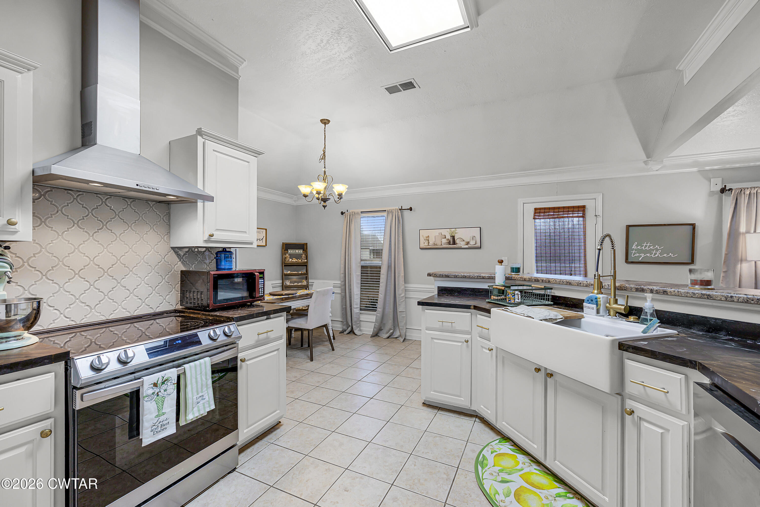 23 Matrix Cove Jackson, TN 38305 - Photo 8 of 19 a kitchen with stainless steel appliances a stove a sink and a refrigerator