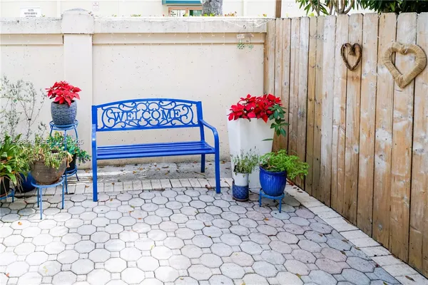 a view of a bunch of flowers in front of a door